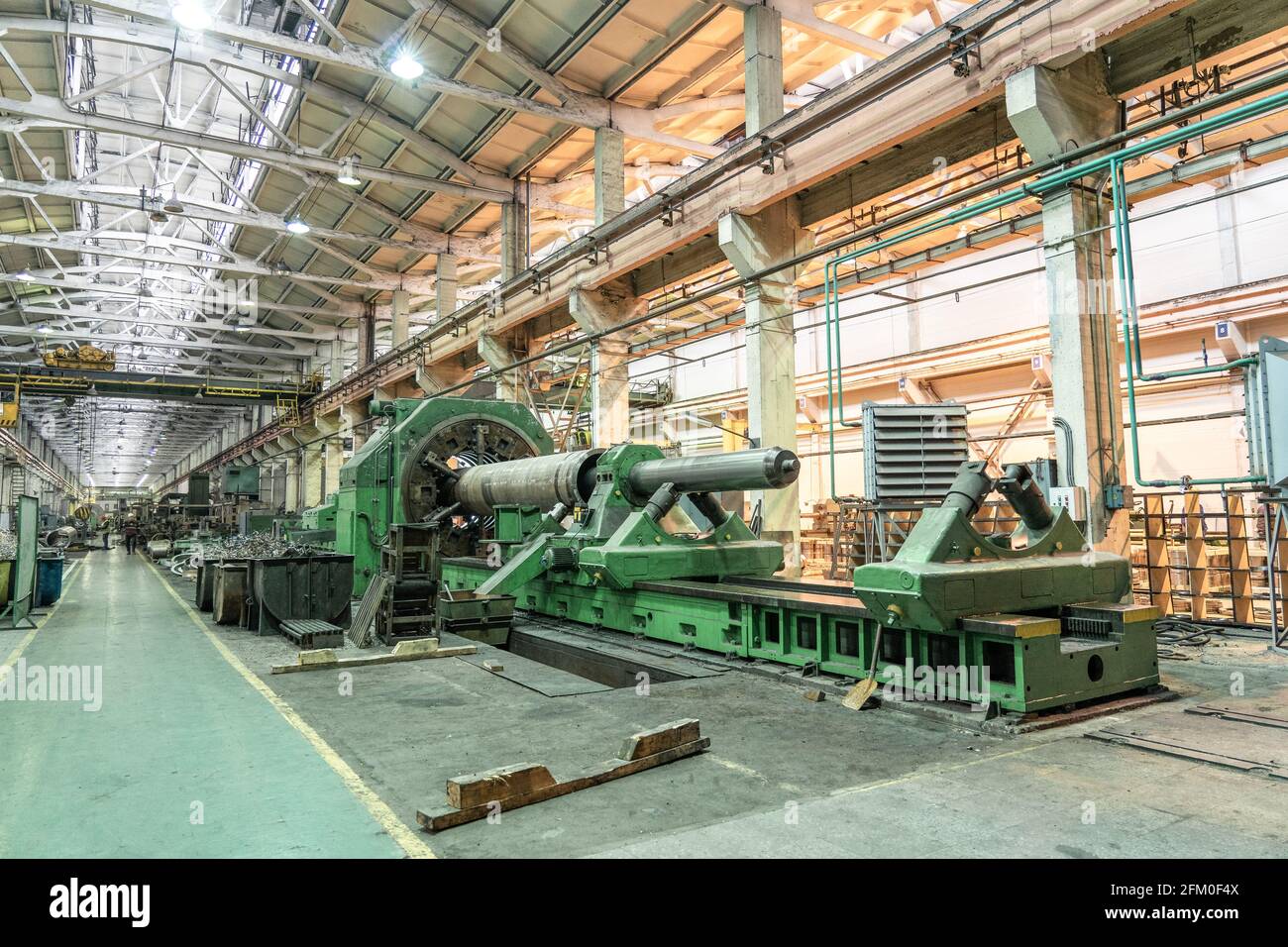 Large industrial factory interior with machines, lathes and
