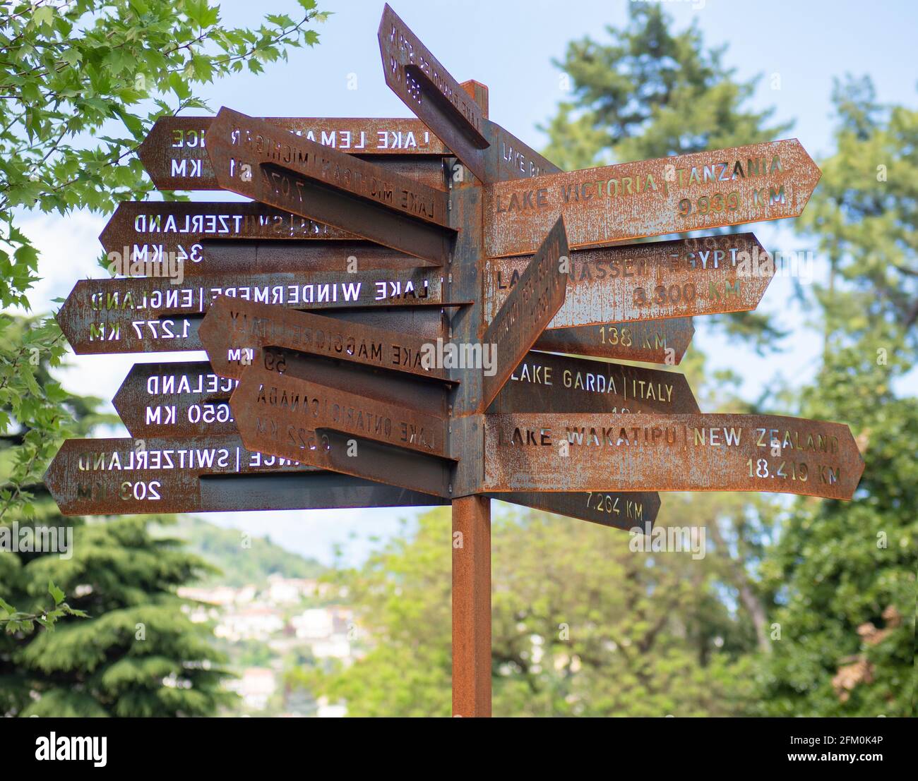 Signs indicating the distance from Como lake to lakes around the world.Cernobbio, Como lake, Italy Stock Photo