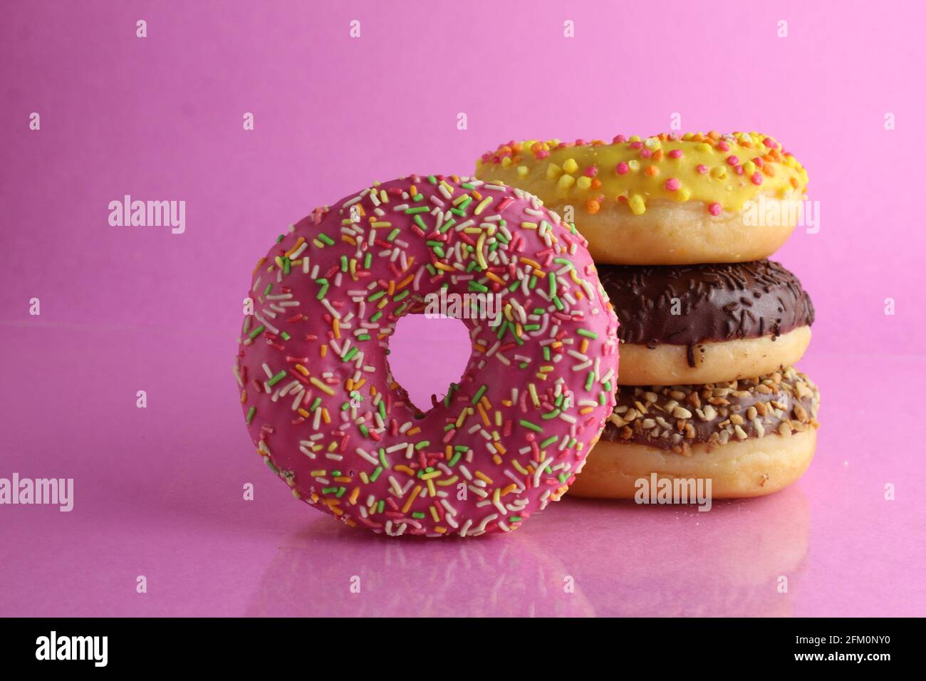 Sweet still life donut berliner close-up at the back lie a stack of ...