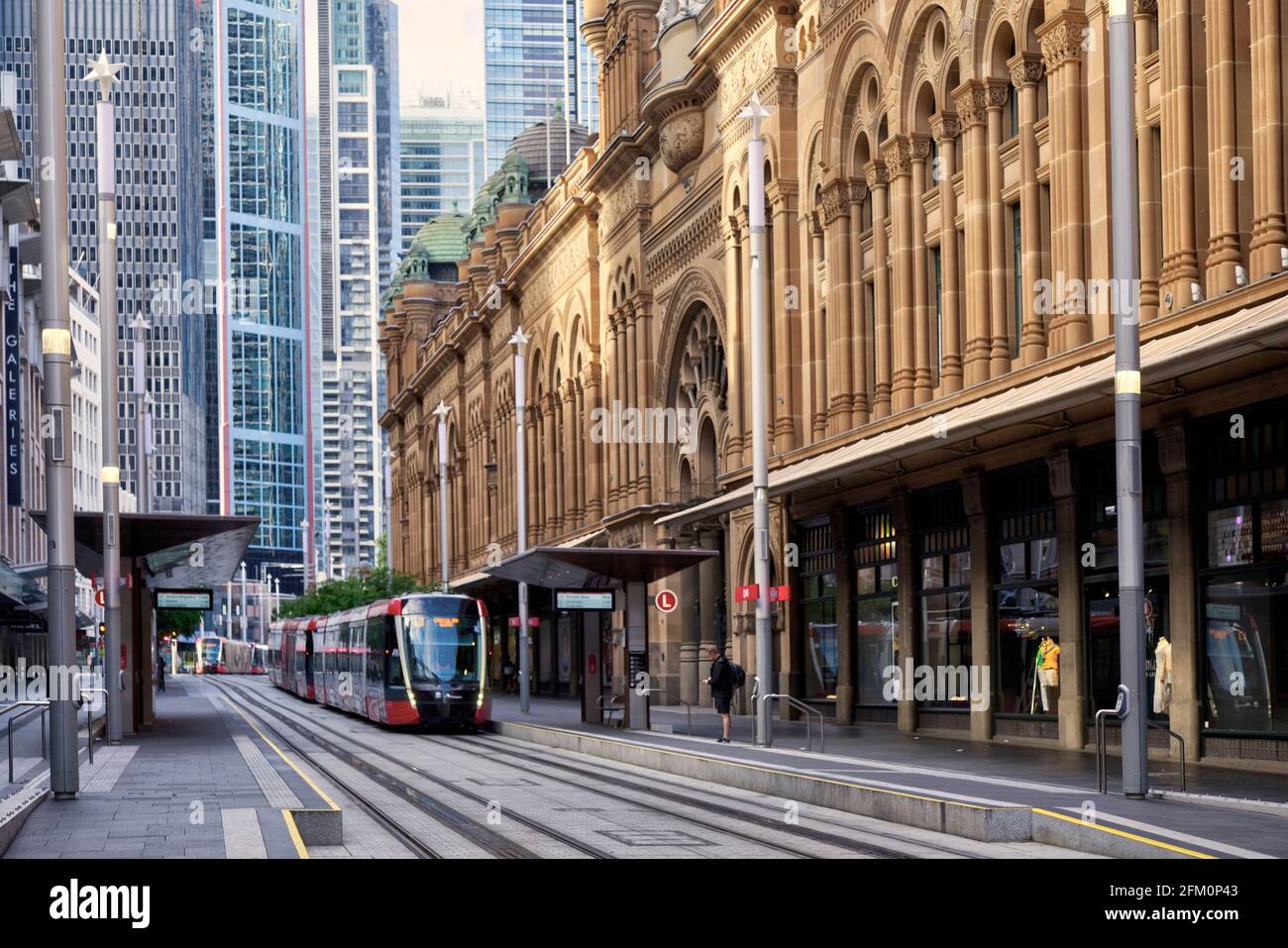 The Electric Light Rail Tram system passing the QVB on George Street Sydney Australia Stock Photo
