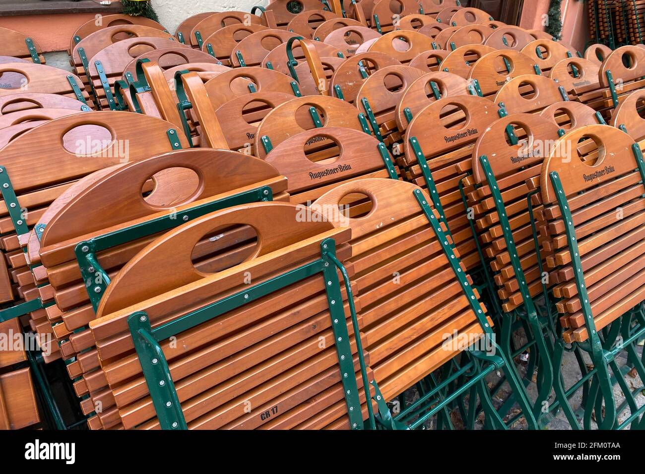 Munich, Germany. 05th May, 2021. Topic picture: Coronavirus pandemic/consequences for gastronomy: Stacked chairs and tables lean against the wall of a Bavarian restaurant of the Augustiner brewery in Munich. | usage worldwide Credit: dpa picture alliance/Alamy Live News Stock Photo