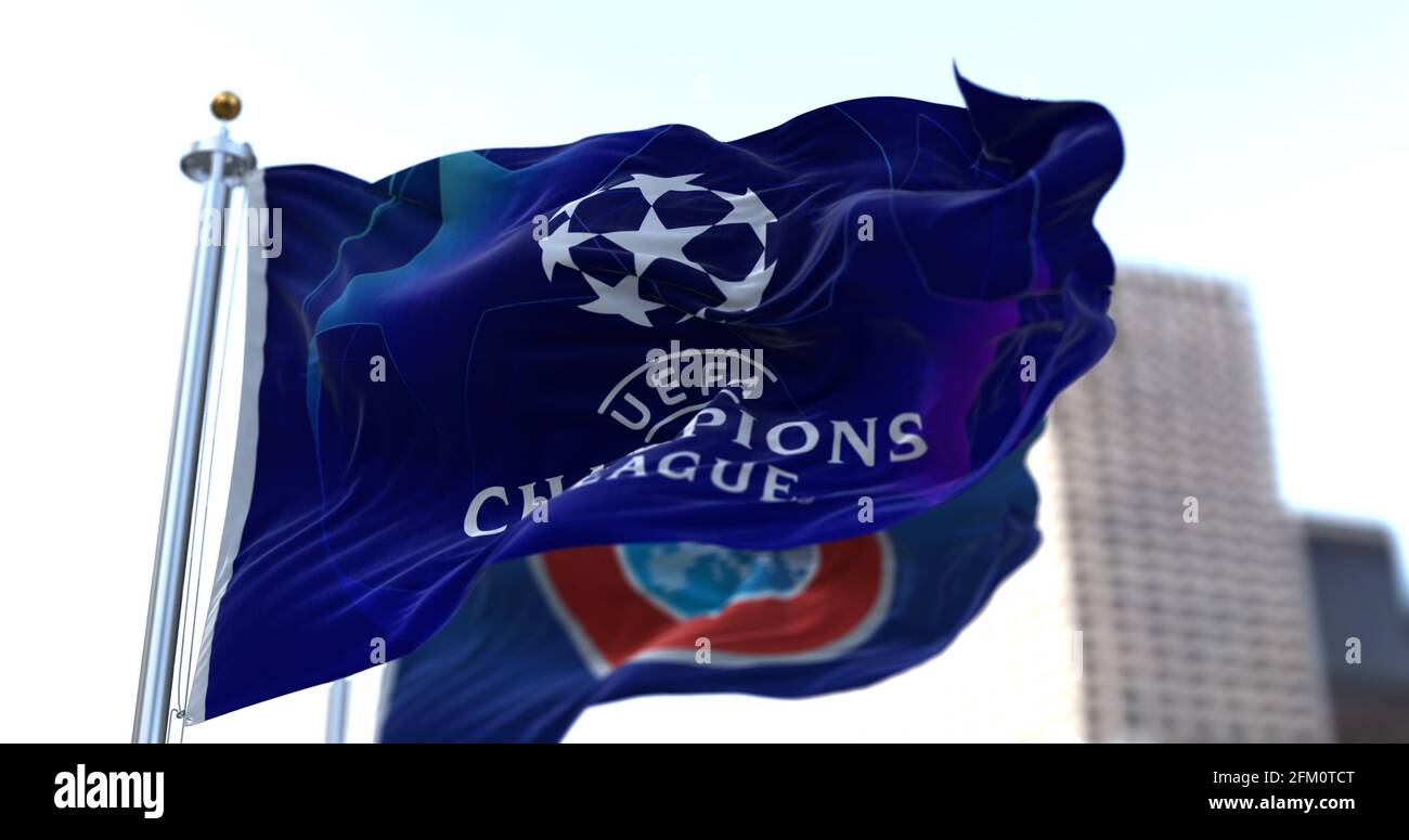 Nyon, SWI, May 2021: The flag of Champions League flapping in the wind with the UEFA flag blurred in the background. Champions League is the most impo Stock Photo