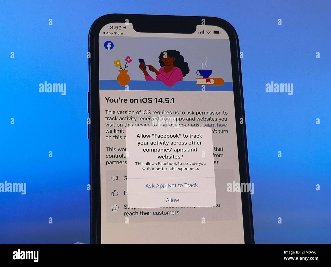 Berlin, Germany. 05th May, 2021. A privacy notice appears on an iPhone 12  under the new iOS 14.5.1 operating system. Developers of an application  have to ask for the user's permission to