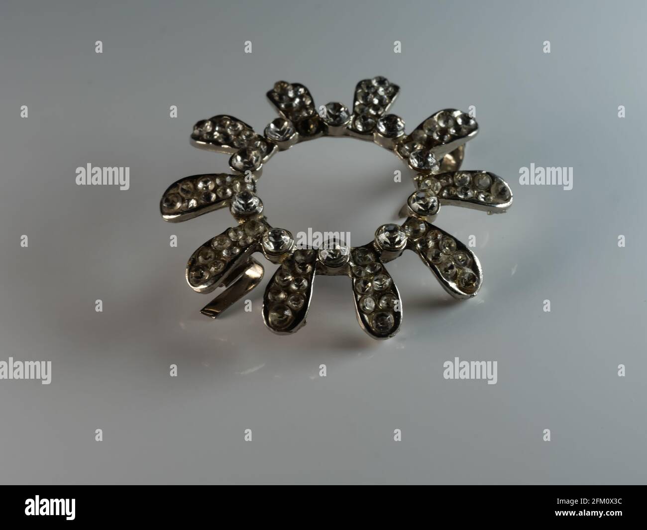 Brooch with pearls isolated on black, with diamonds, selective focus, DOF, macro, on white background Stock Photo