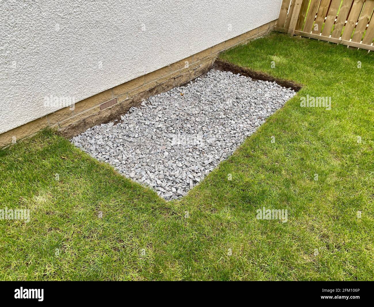 House garden grass turf cut for ground preparation to allow stone sub base  to be laid Stock Photo - Alamy