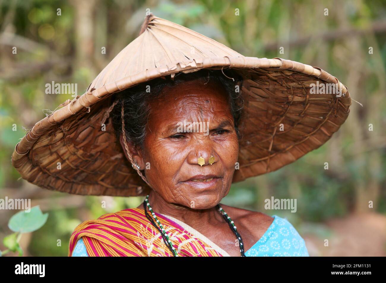 Tribal woman wearing coolie hat at Jakkaraguda Village in Srikakulam District, Andhra Pradesh, India. SAVARA TRIBE Stock Photo