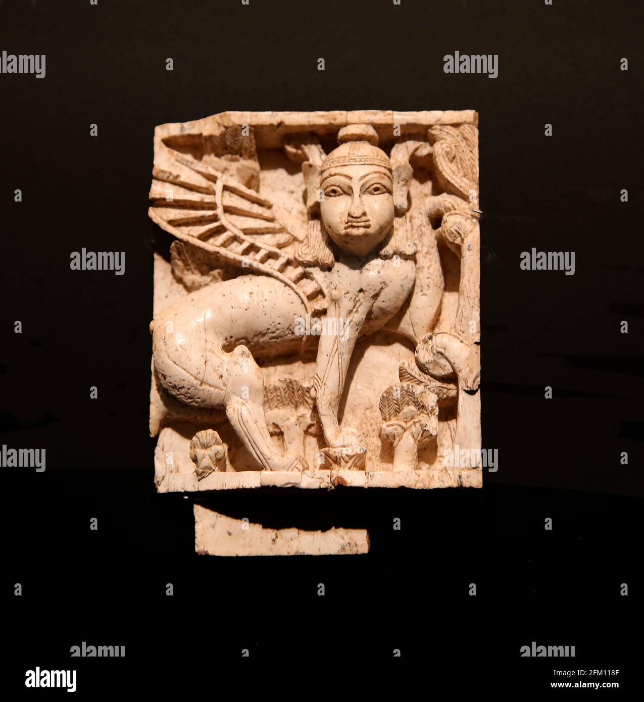 Ivore decorative plaque. Fort Shalmaneser, Nimrud, Iraq. Sphinx. 900-700 BC. Ivory. British Museum. London. GRB. Stock Photo