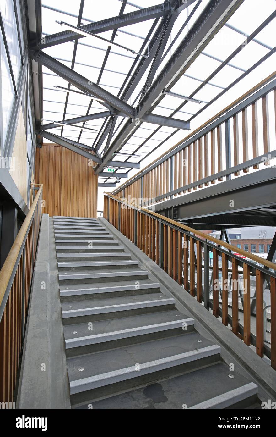 Interior of new, 3 storey bike storage building next to the railway station in Kingston upon Thames, London. Timber and steel structure. Stock Photo