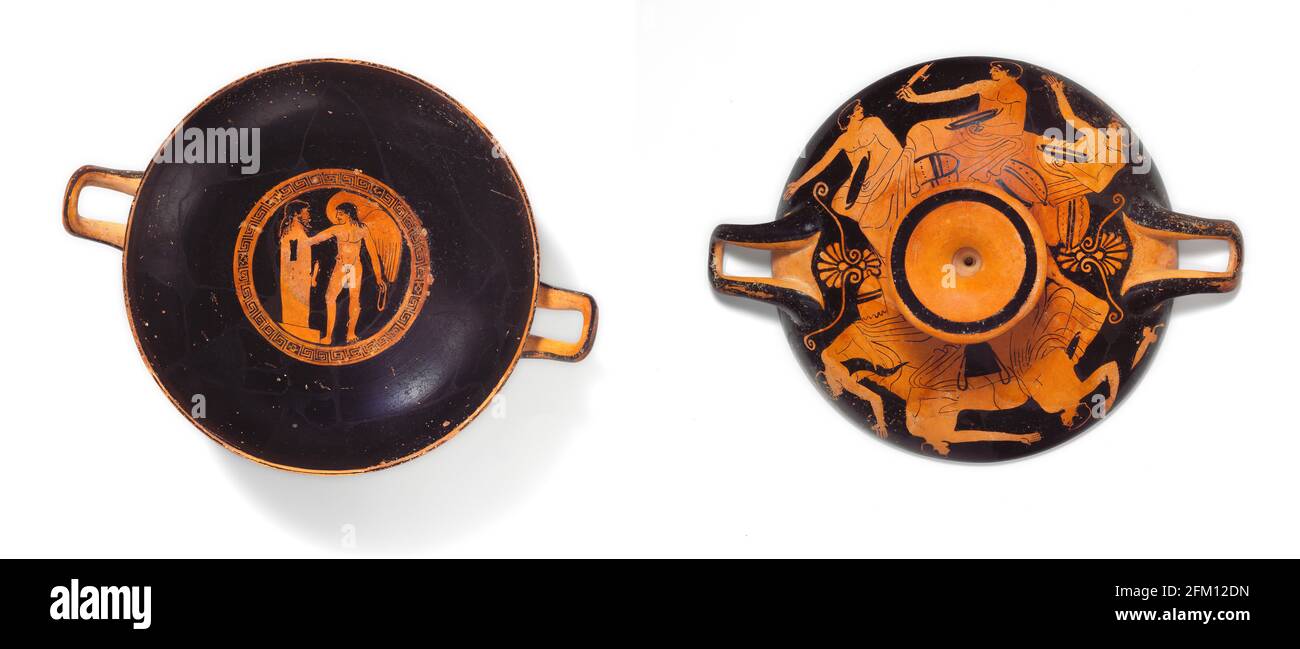 Greek Terracotta kylix (drinking cup) mid-5th century B.C. - Interior, Eros at a herm Exterior, obverse and reverse, banqueters Stock Photo