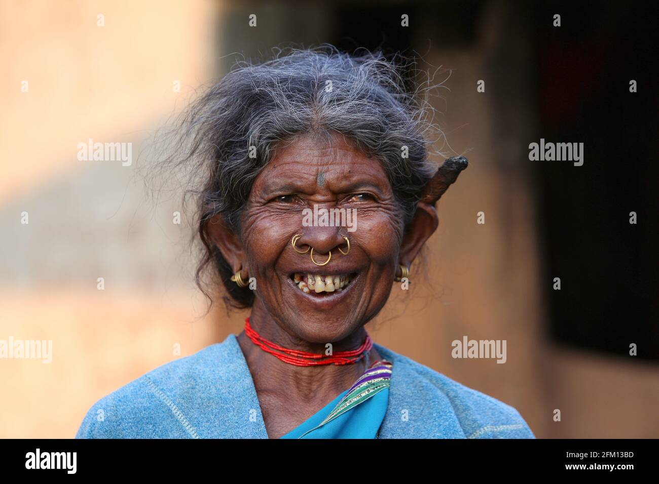 Tribal old woman with cigar at Korrakothavalasa Village in Araku, Andhra Pradesh, India. KONDHU TRIBE Stock Photo