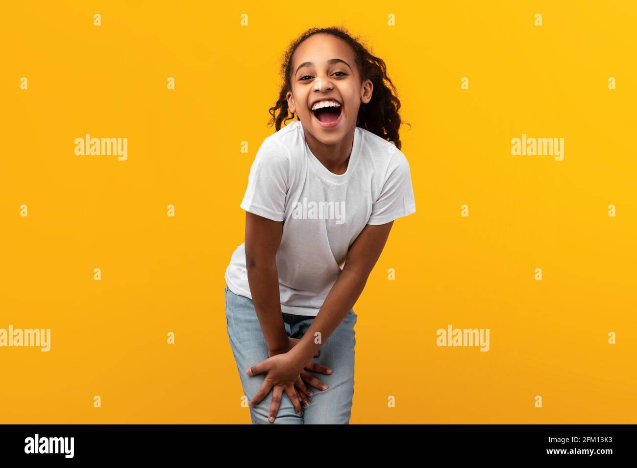 Cute Joyful African American Girl Laughing At Camera Stock Photo - Alamy