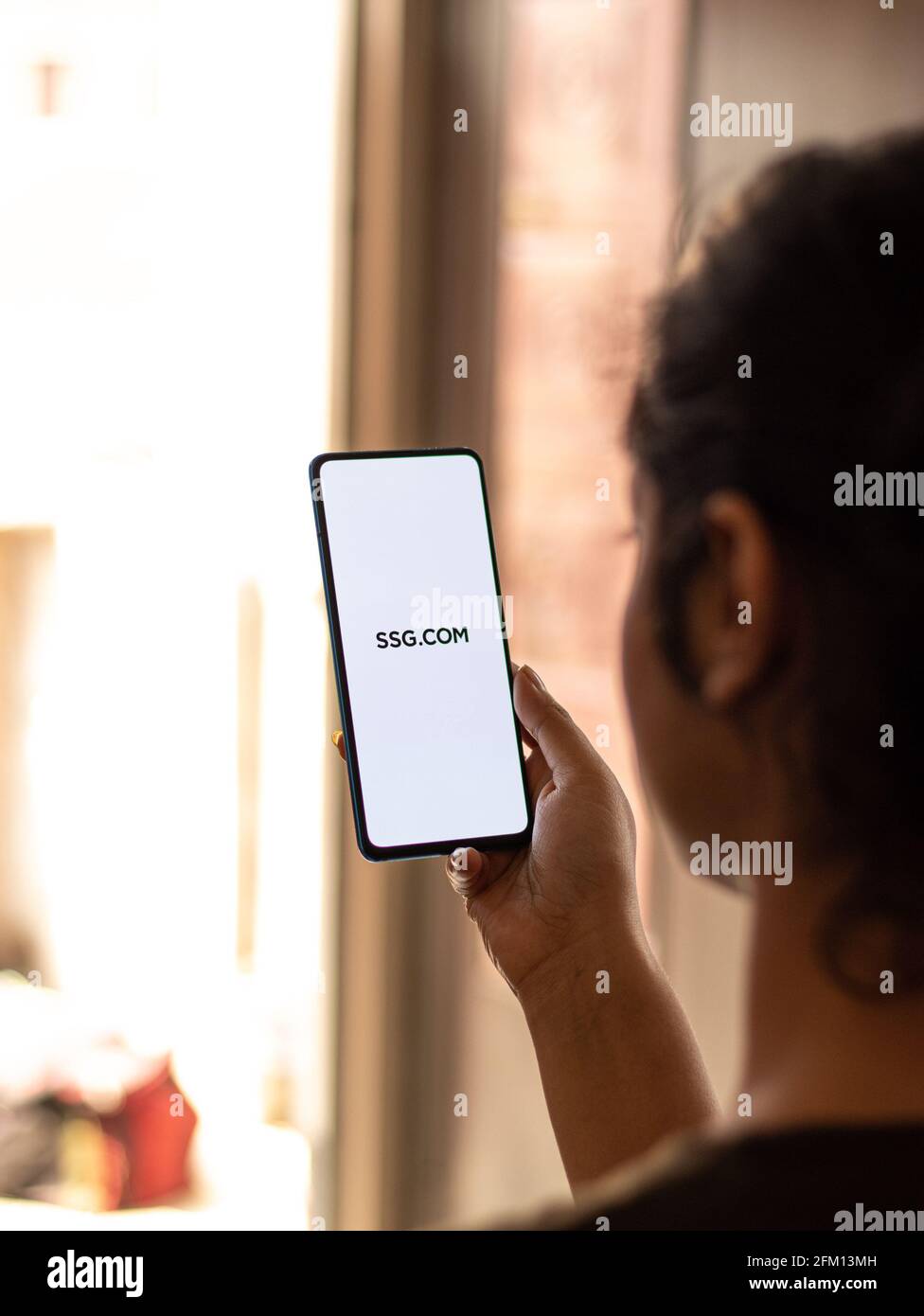 Assam, india - May 04, 2021 : SSG.COM logo on phone screen stock image. Stock Photo