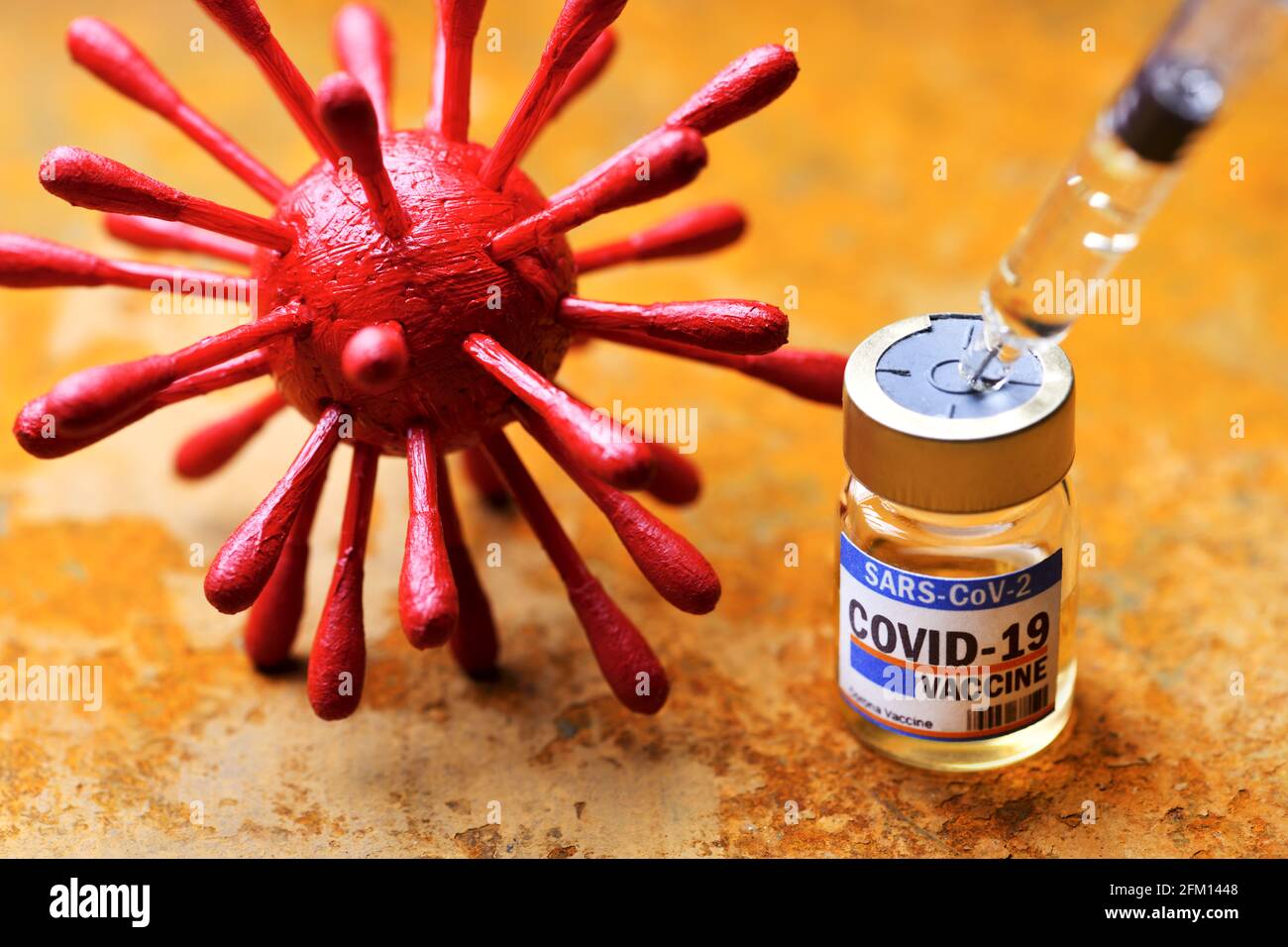 Vaccine Vial, Syringe And Coronavirus Model, Covid Vaccination Stock Photo