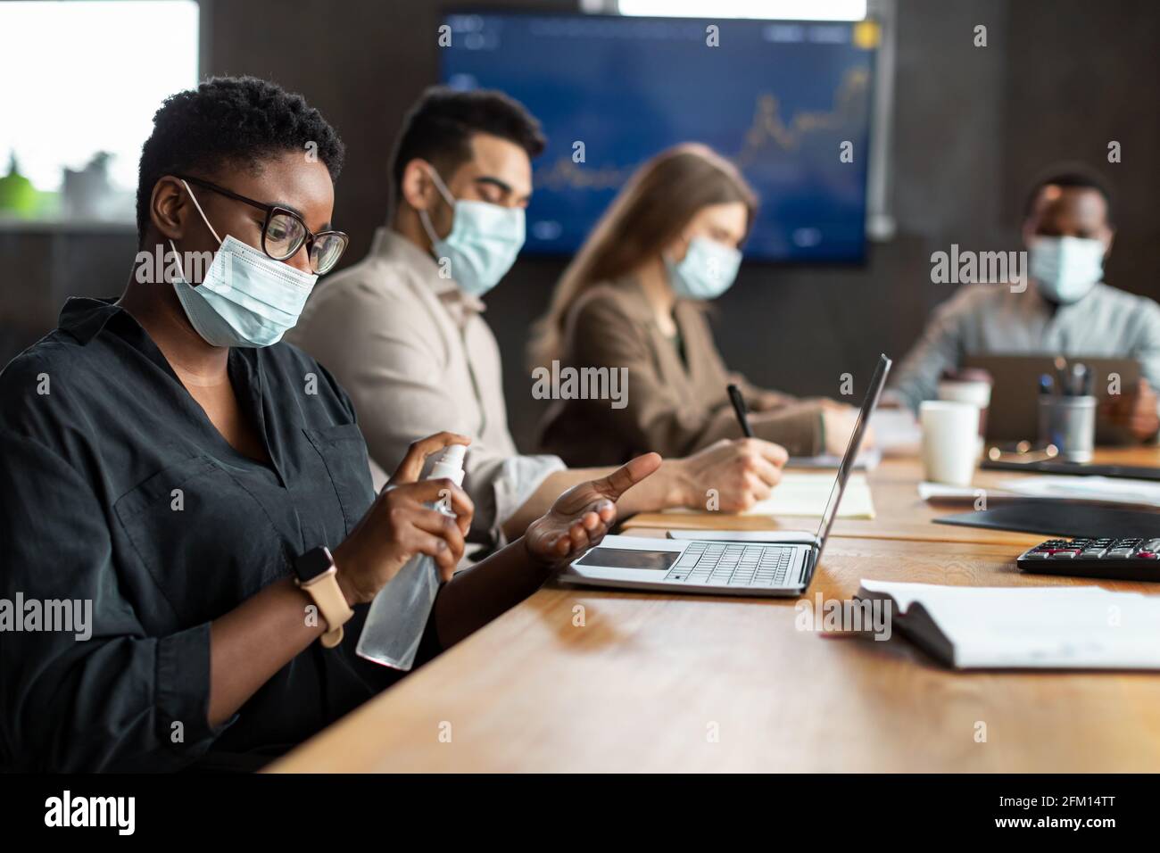 International people wearing medical masks using sanitizer Stock Photo ...