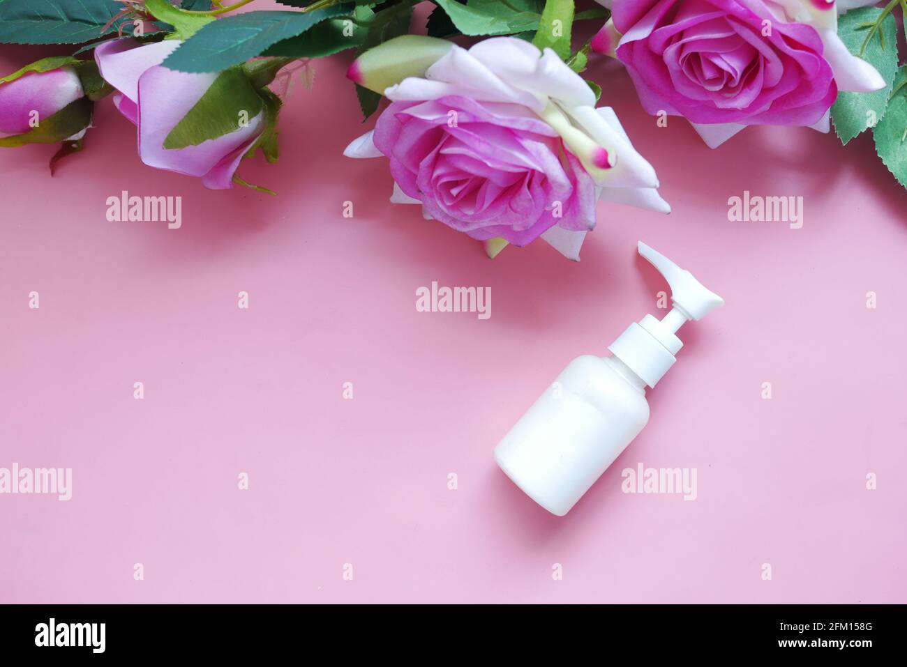 face cream in a container and pink color rose flower  Stock Photo
