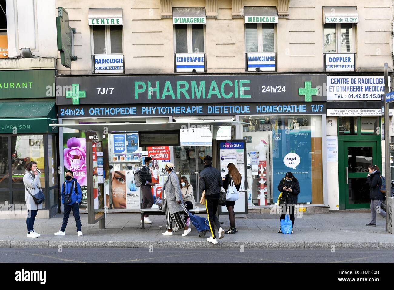 Pharmacy with a bus stop - Paris - France Stock Photo