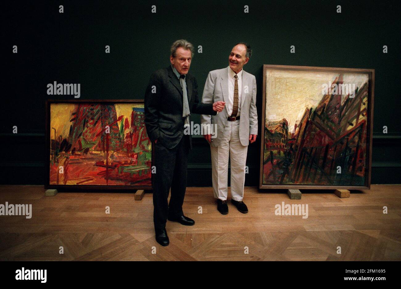 Lucien Freud meeting with Frank Auerbach as Auerbach's painting are hung at the royal acadamy. 5/9/01 pilston Stock Photo