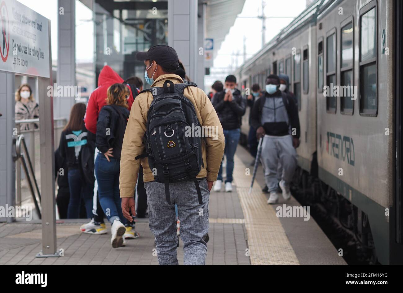 Students traveling on local public transport in Bergamo, Lombardy, Italy. Stock Photo