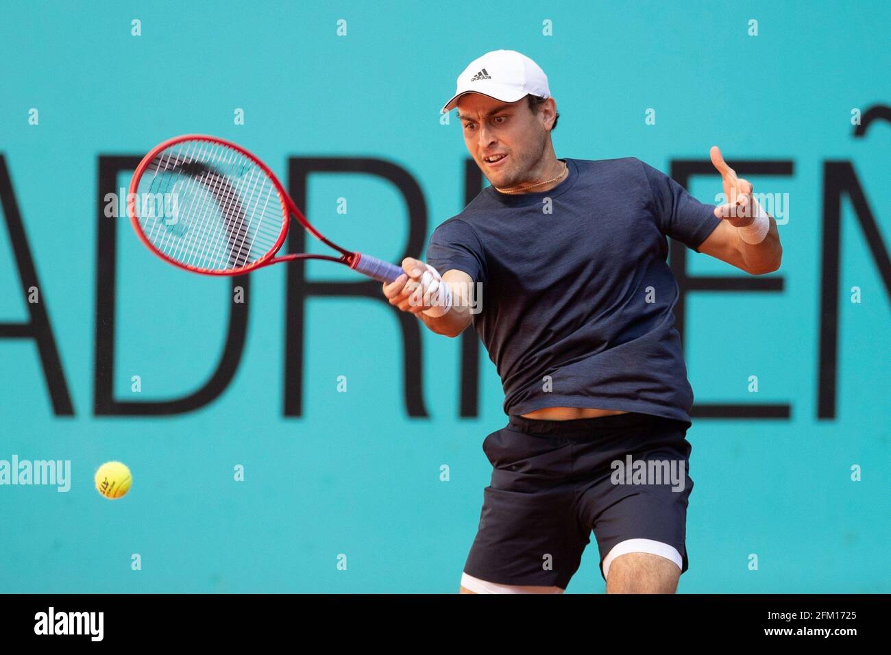 Madrid, Spain. 05th May, 2021, Aslan Karatsev of Russia in action against  Diego Schwartzman of Argentina during their Mutua Madrid Open round of 32  match held in Madrid, Spain, 05 May 2021.