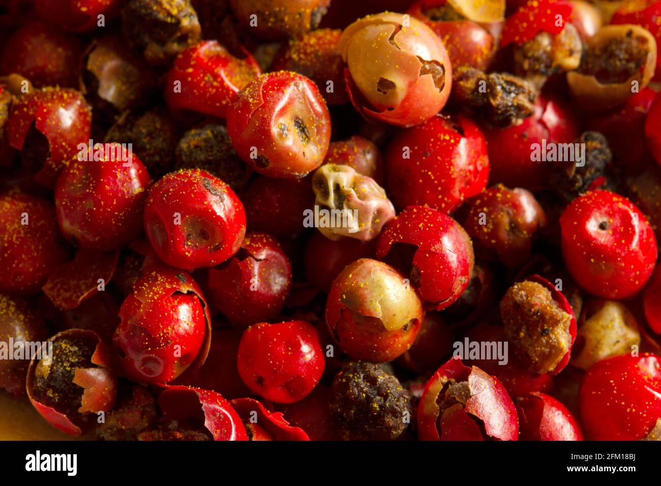 Red hot pepper and black pepper seeds Stock Photo Alamy