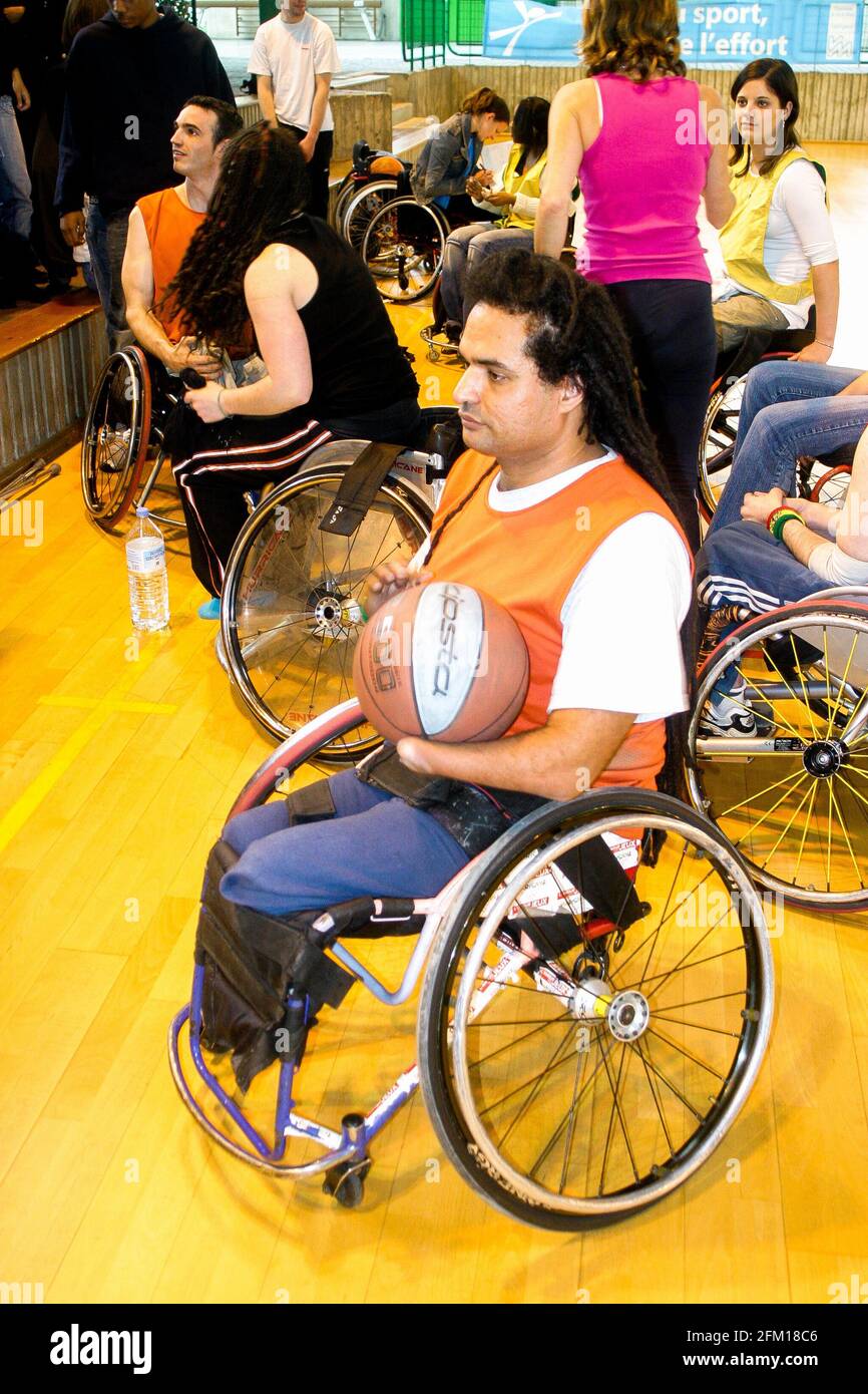 French disabled basket-ball player Ryad Salem conducts training session for  young people, Orly, Ile-de-France, France Stock Photo - Alamy