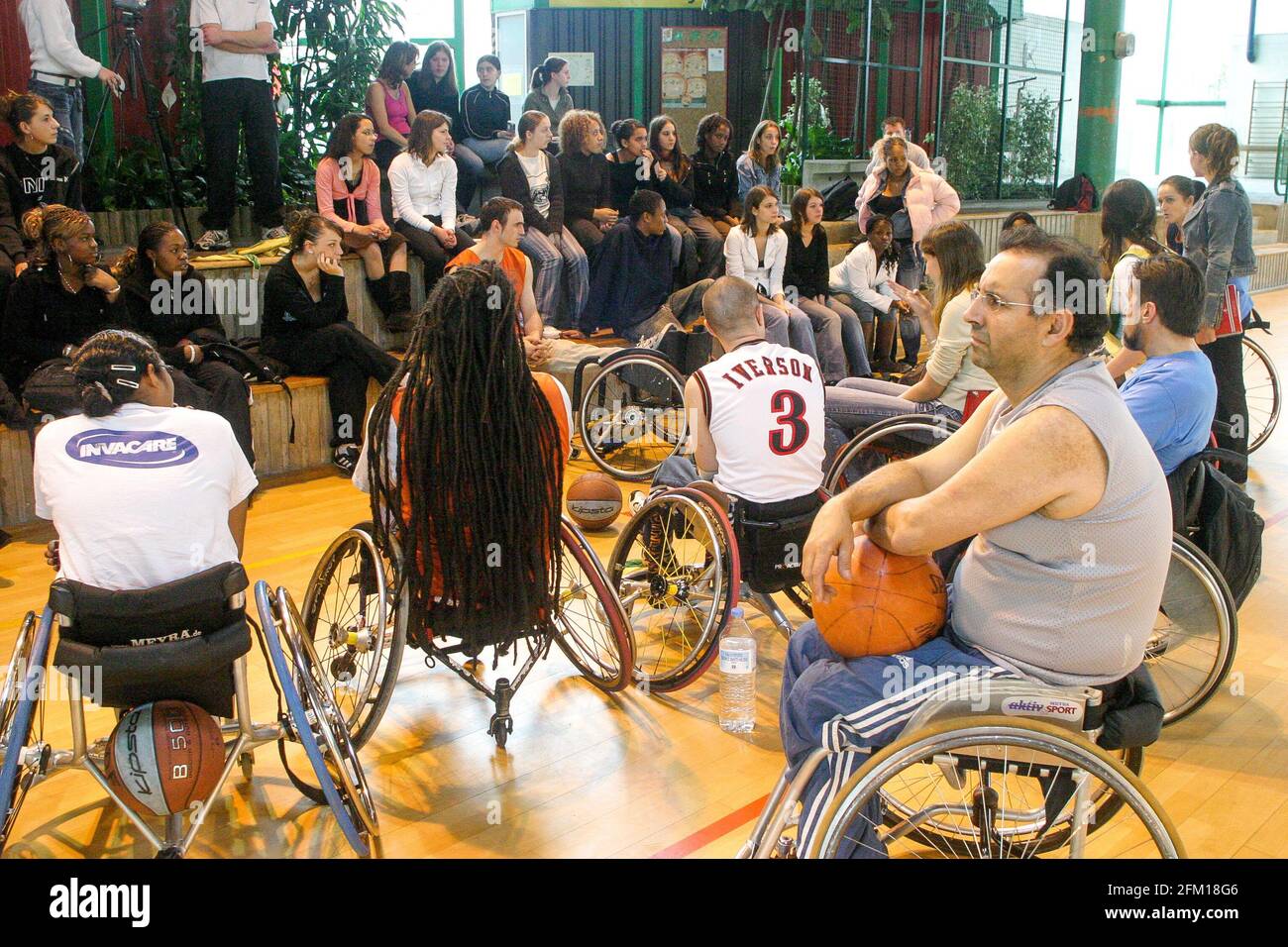 French disabled basket-ball player Ryad Salem conducts training session for  young people, Orly, Ile-de-France, France Stock Photo - Alamy