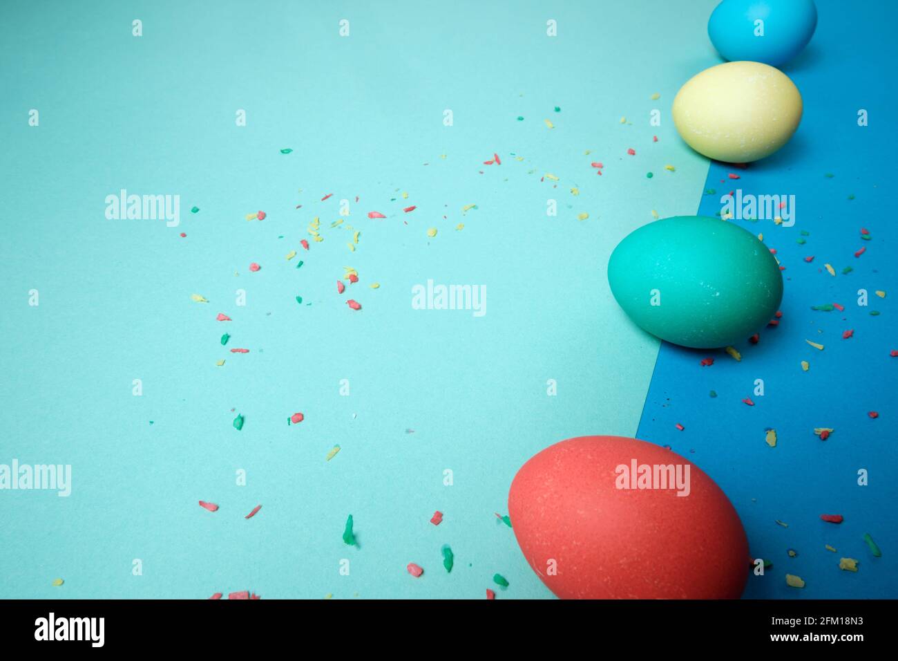 Colored chicken eggs. Easter holiday. Abstraction. Place for text. Stock Photo