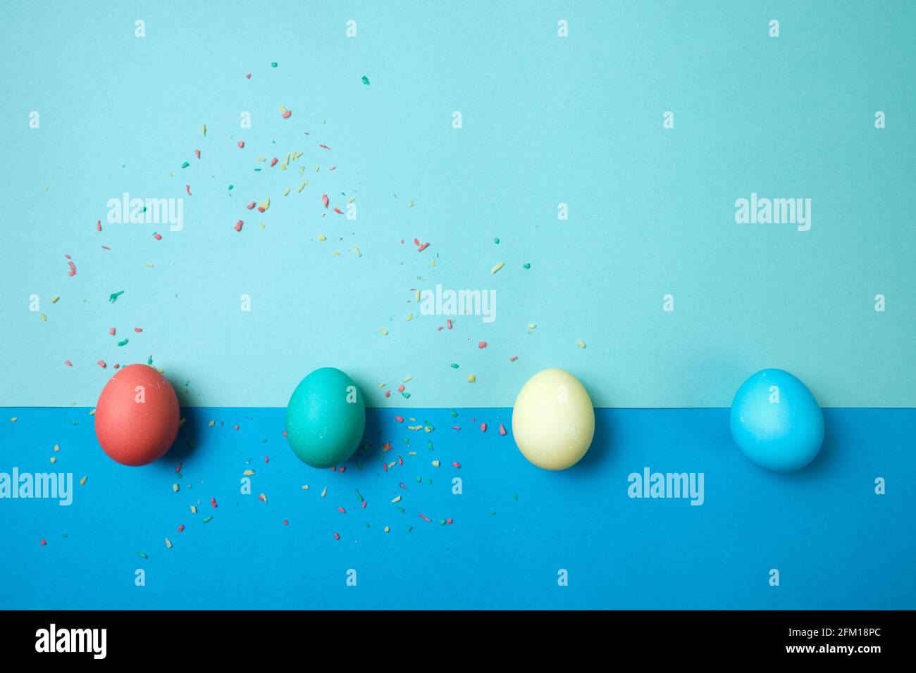 Colored chicken eggs. Easter holiday. Abstraction. Place for text. Stock Photo
