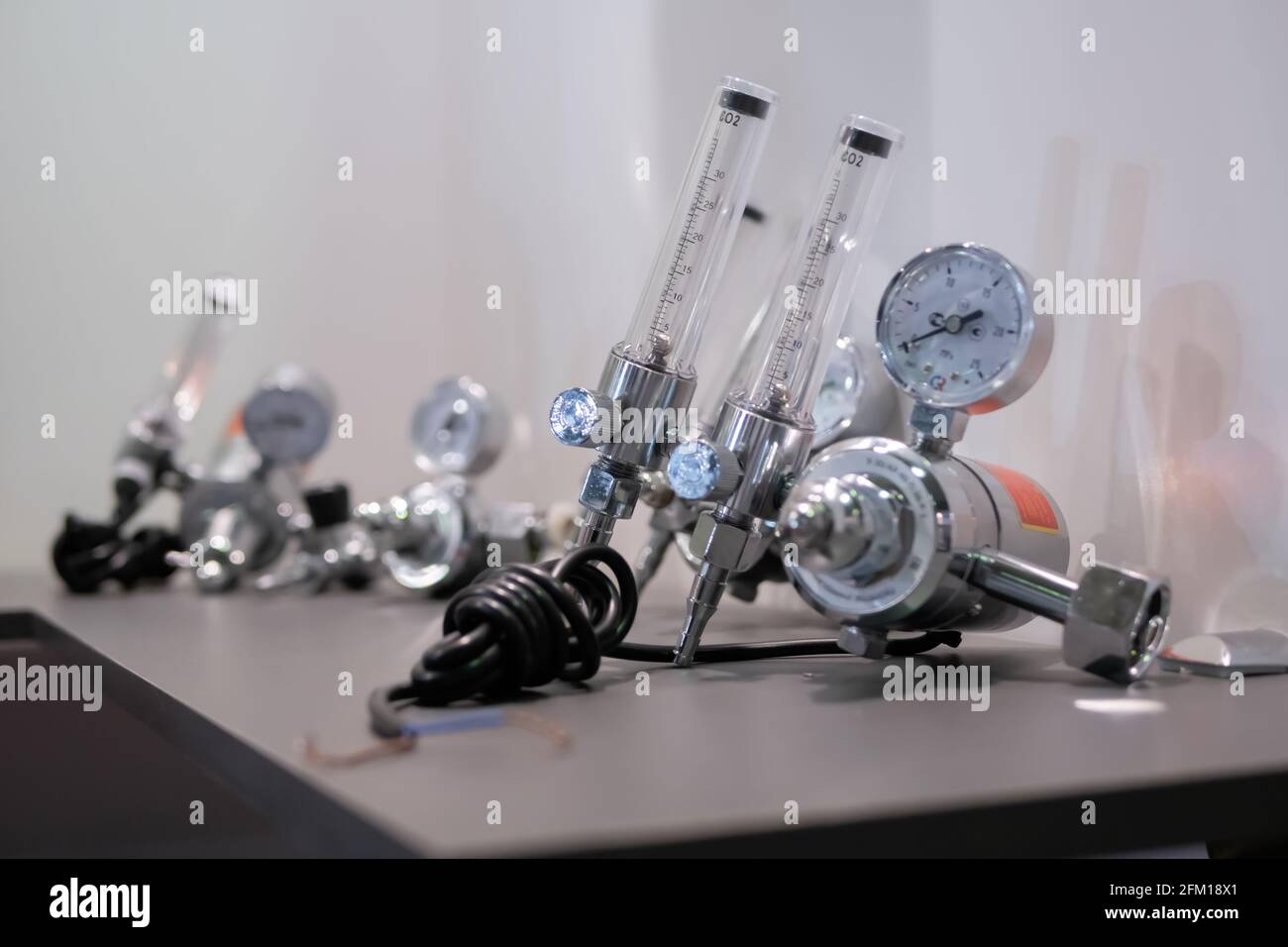 Gas flowrate regulators and flow measuring units on table at exhibition