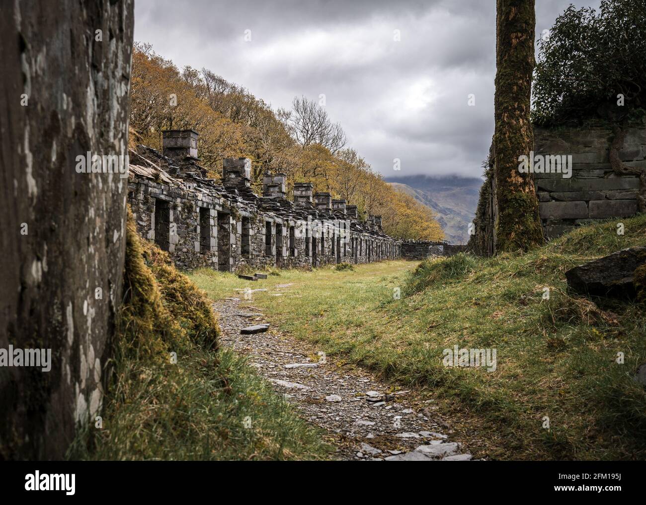 Row of abandoned old miners cottages in slate mine quarry Dinorwic