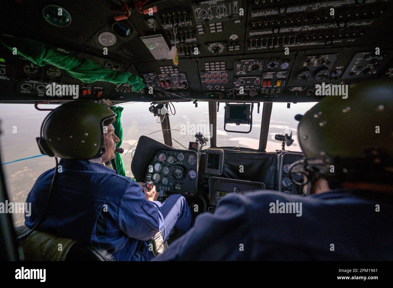 NEAR ZHEZKAZGAN, KAZAKHSTAN - 17 April 2021 - Helicopter pilots navigate to the designated landing zone for the landing  of the Soyuz MS-17 with Exped Stock Photo