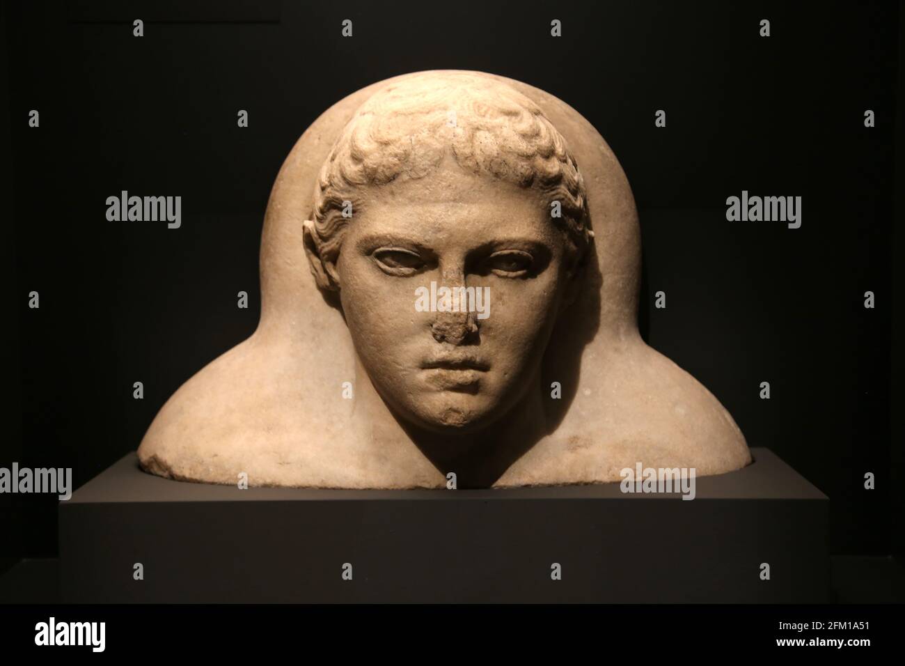 Head from the lid of a marble, sarcophagus with face in Greek style but of Phoenician type. Sidon, Lebanon. 5th-3rd BC. British Museum. London. Stock Photo
