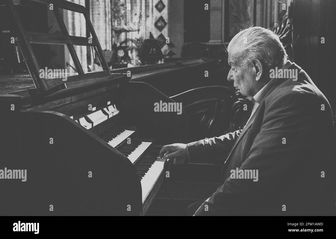 Old Man Playing the Organ in Church Stock Photo