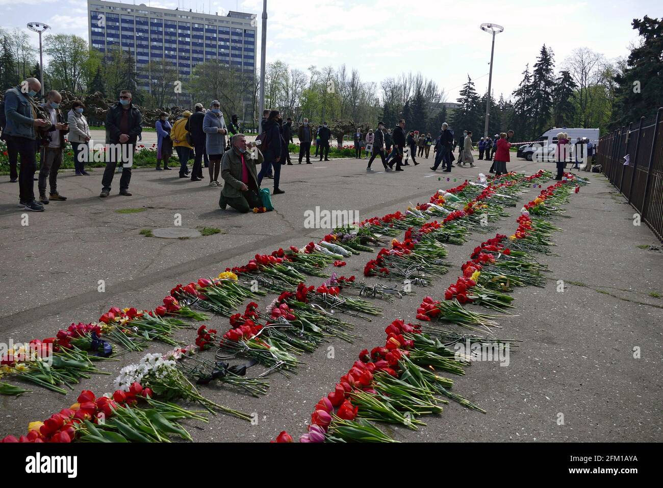 ODESA, UKRAINE - MAY 2, 2021 - Flowers lay on the ground outside the Trade Unions building in memory of the people who died in the fire during the unr Stock Photo