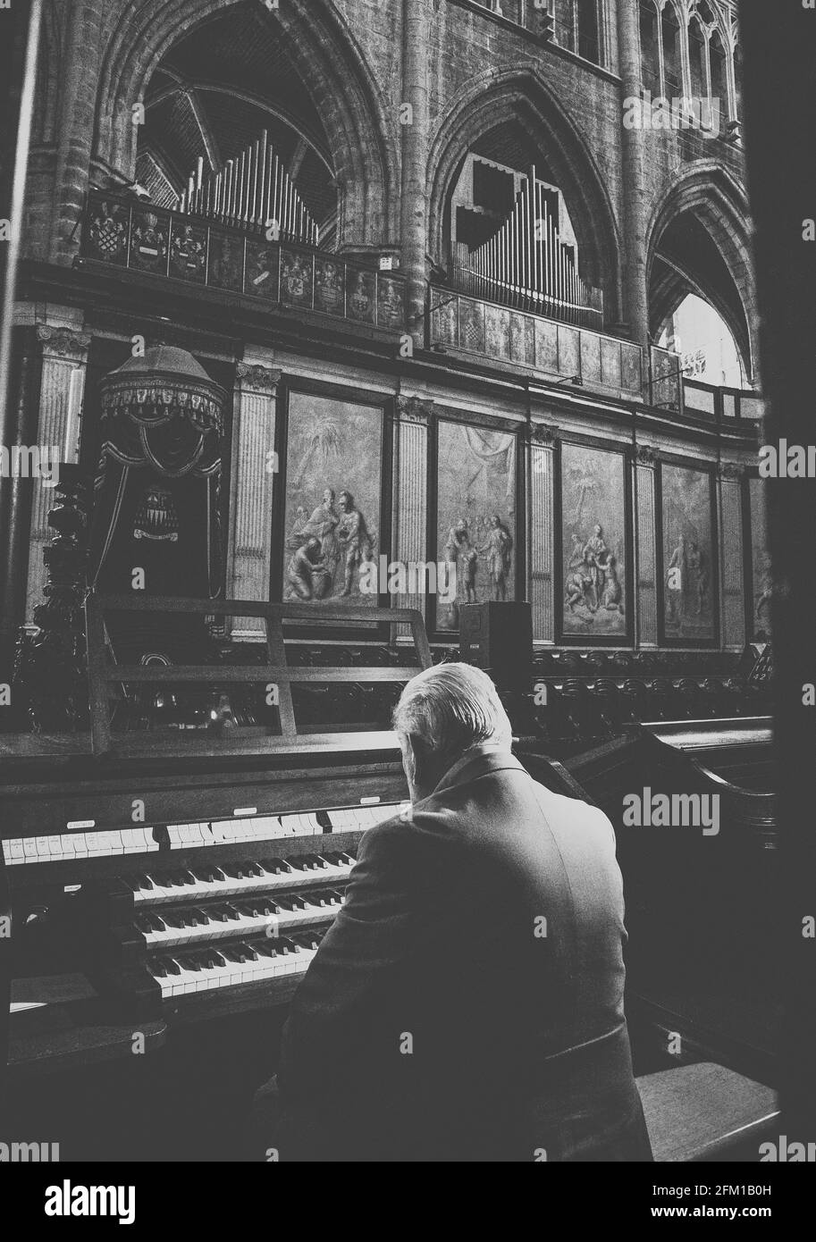 Old Man Playing the Organ in Church Stock Photo