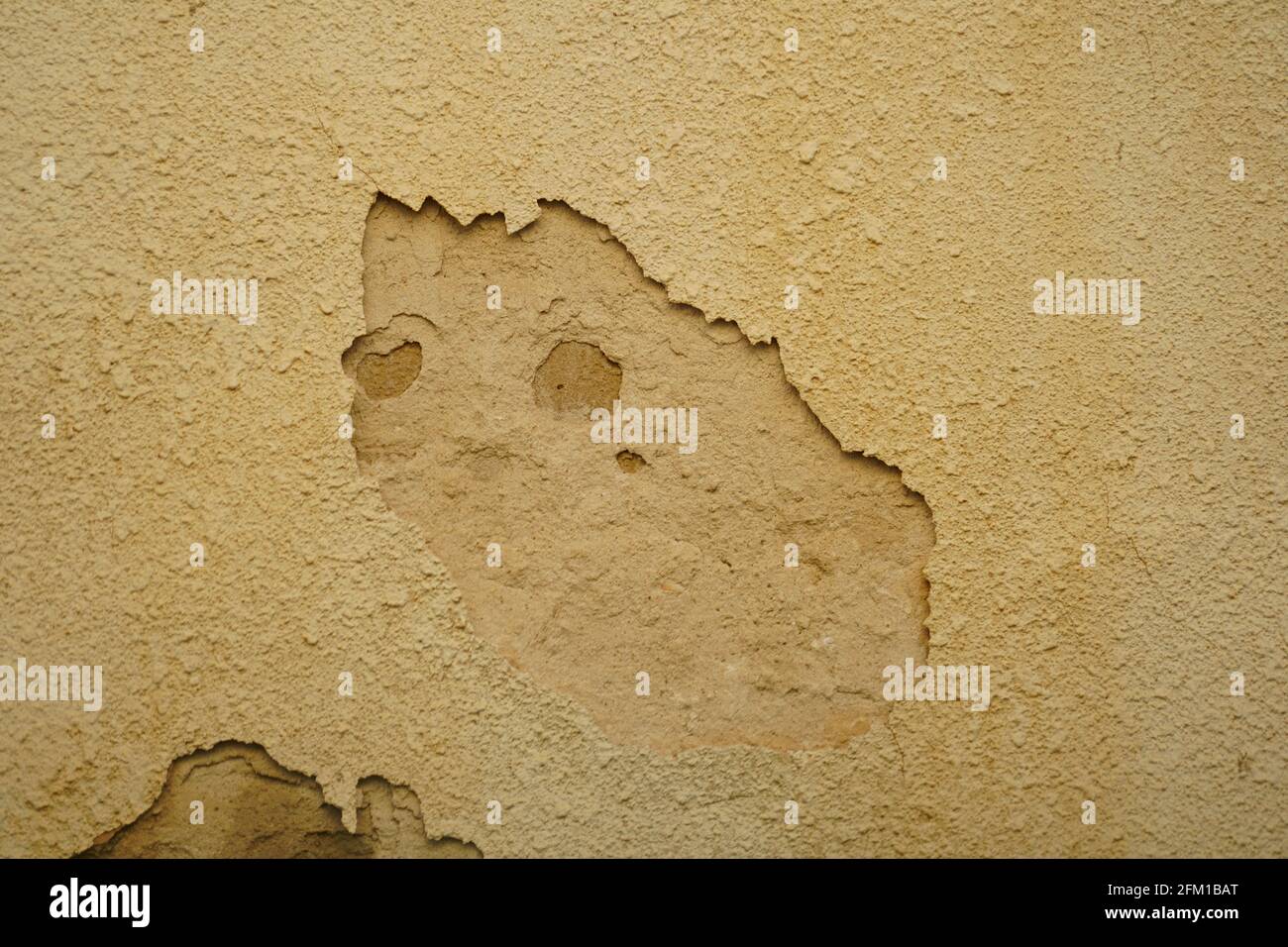 Human Face appears in cracked plaster on a wall Pareidolia is the tendency for incorrect perception of a stimulus as an object, pattern or meaning kno Stock Photo
