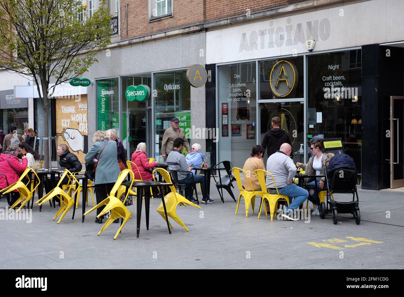 Outdoor coffee and dining at pavement cafe seating in Exeter as Covid19 lockdown restrictions easing initially allows outdoor only hospitality trade. Stock Photo