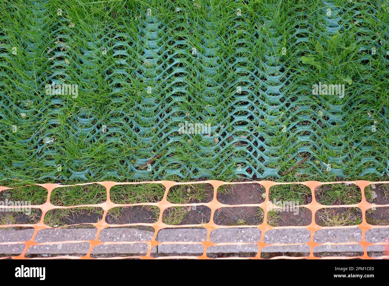 Grass reinforcement mesh installation on high traffic areas and edges