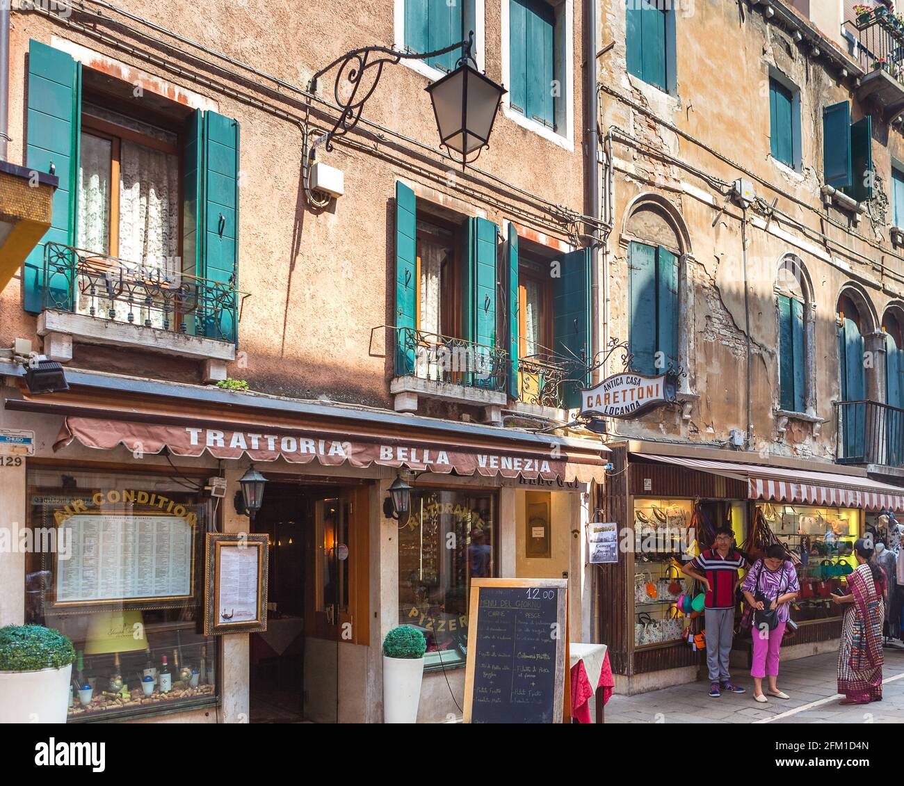 VENICE, ITALY - JUNE 15, 2016 View to little cafe Trattoria bella Venezia based on Rio Terra Lista di Spagna street Stock Photo