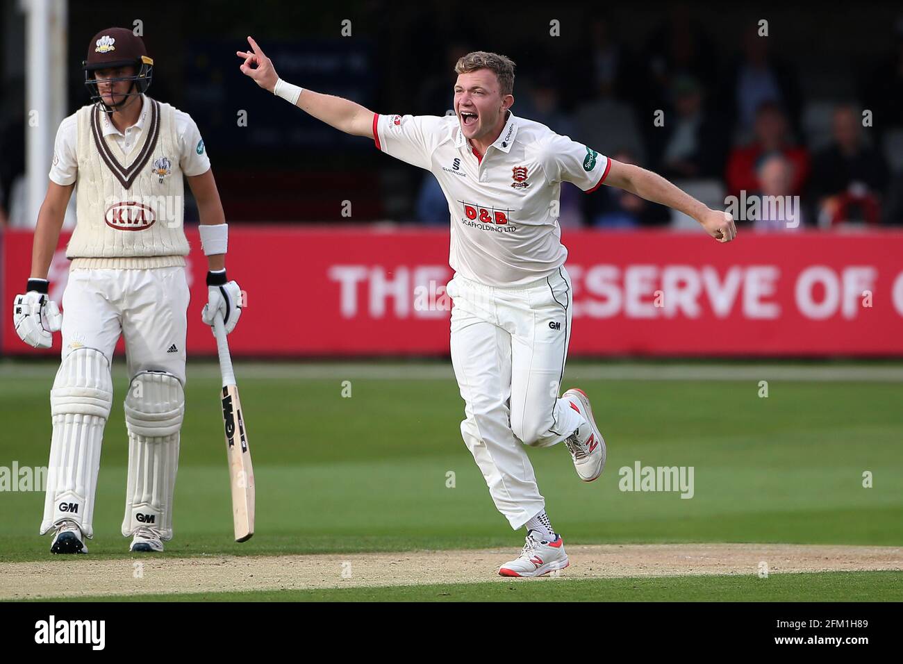 Sam Cook of Essex celebrates taking the wicket of Ollie Pope during