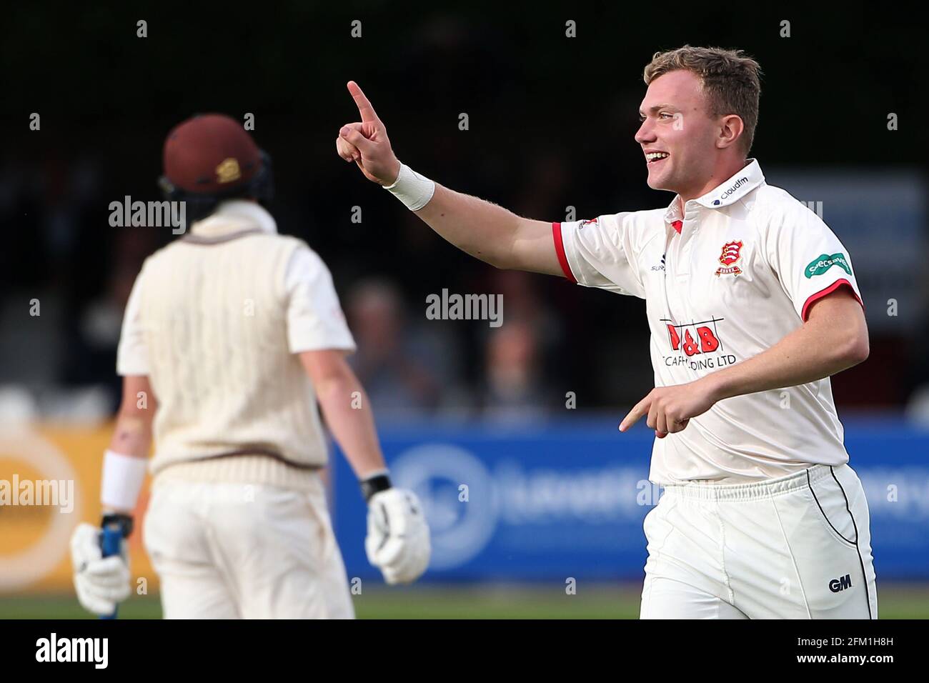 Sam Cook of Essex celebrates taking the wicket of Ollie Pope during