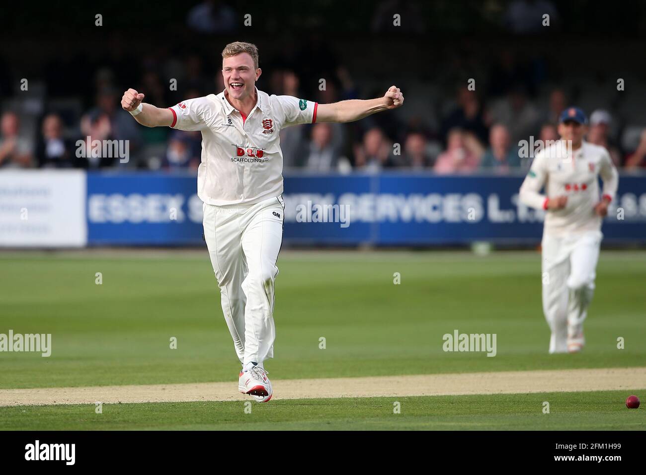 Sam Cook of Essex celebrates taking the wicket of Ollie Pope during