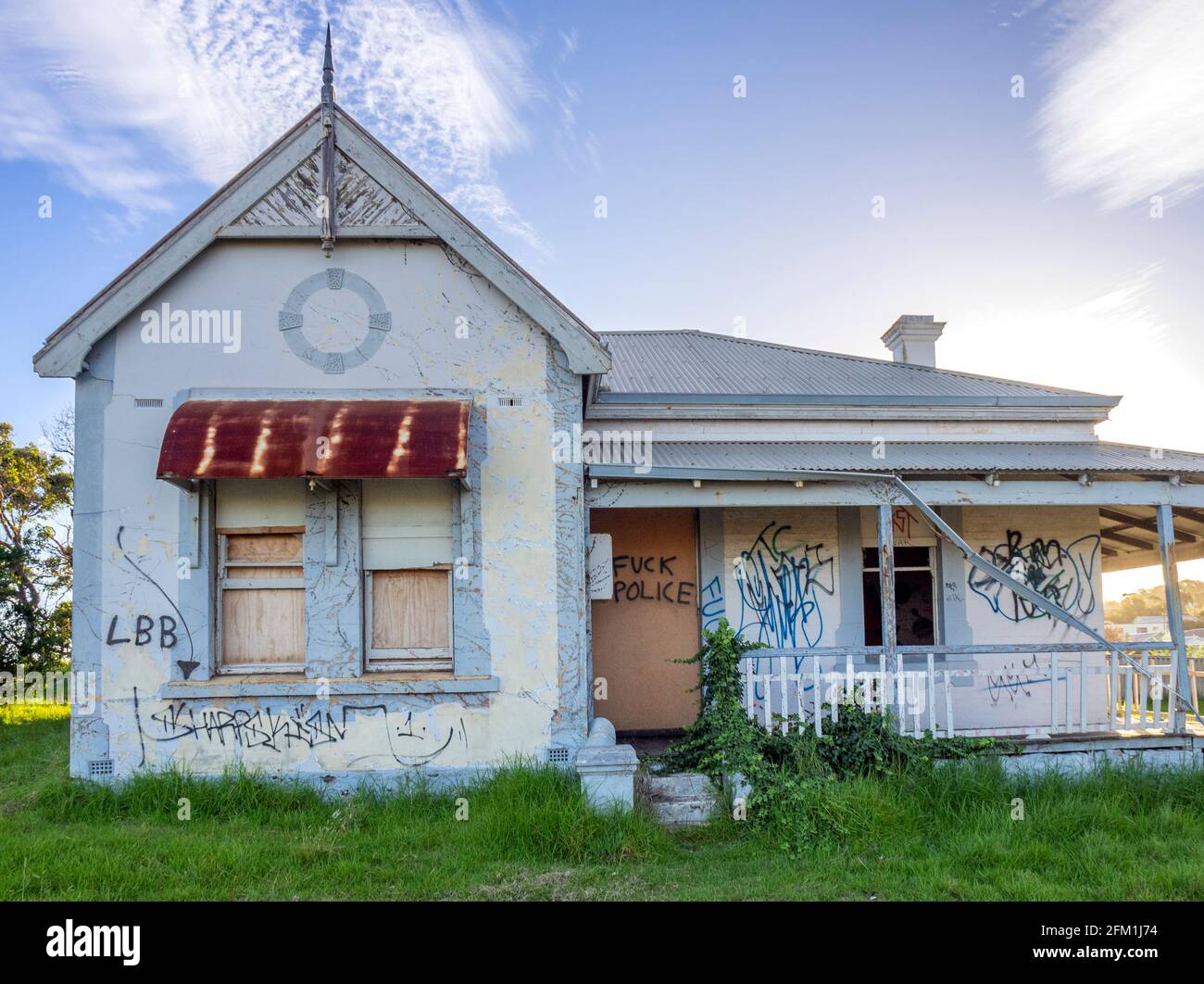 Graffiti on the external walls of an abandoned house. Stock Photo