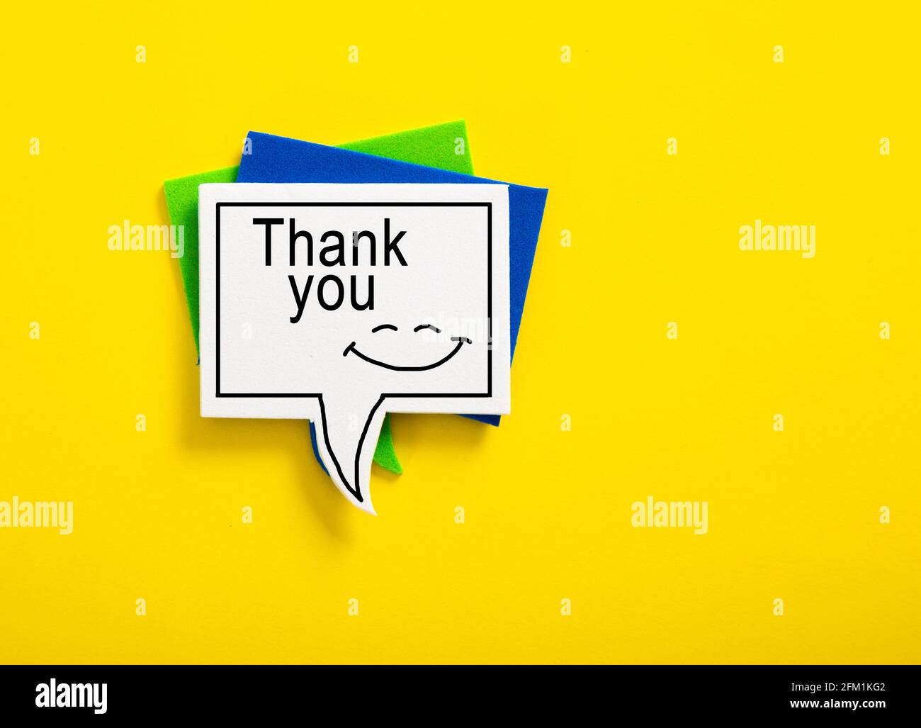 colorful speech bubble written with Thank You on yellow background ...