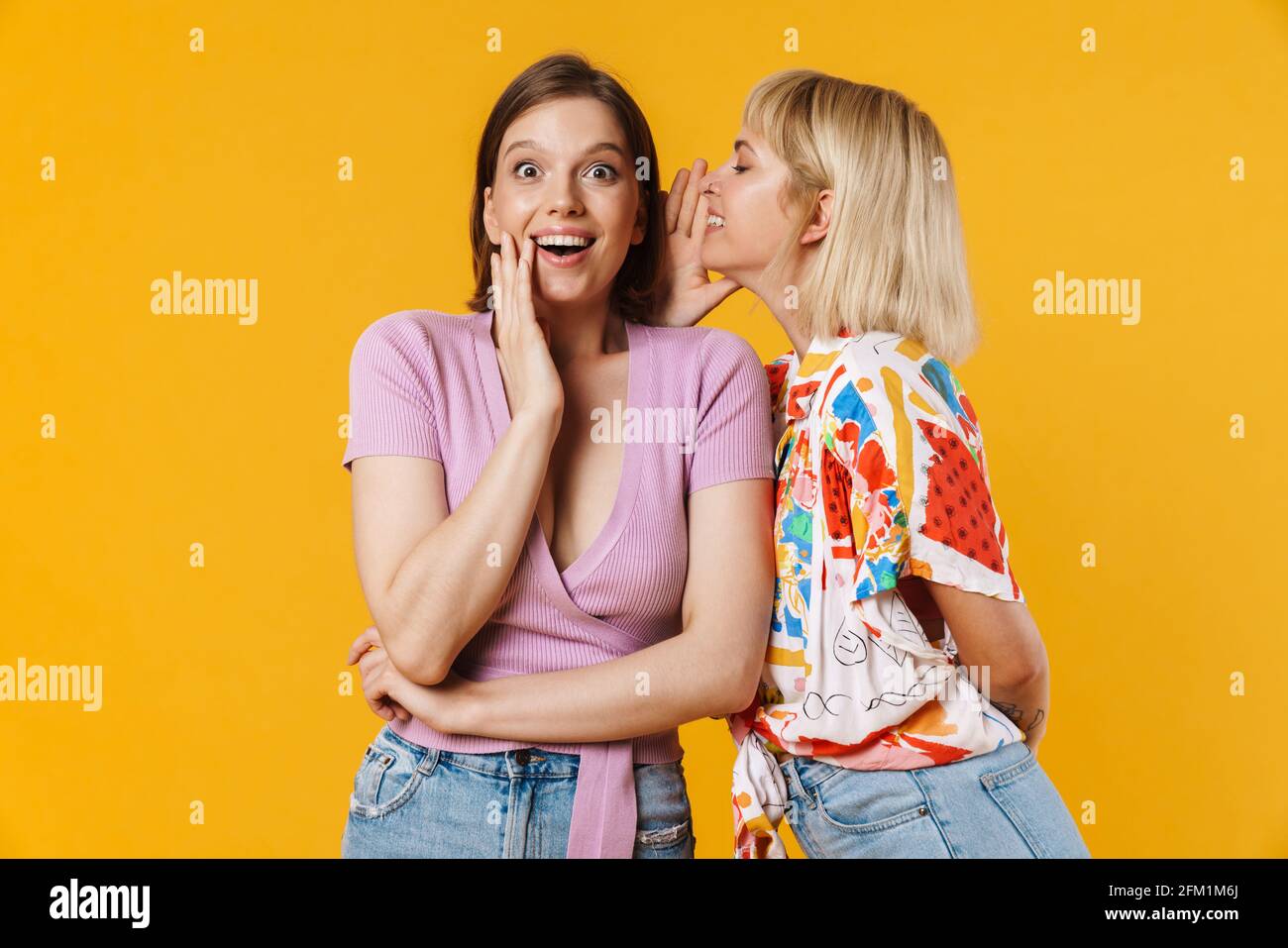 Portrait Of Two Cheerful Lovely Girlfriends Wearing Summer Clothes Portrait Of Two Cheerful Lovely Girlfriends Wearing Summer Clothes