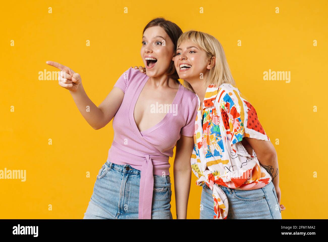 Portrait Of Two Cheerful Lovely Girlfriends Wearing Summer Clothes Portrait Of Two Cheerful Lovely Girlfriends Wearing Summer Clothes