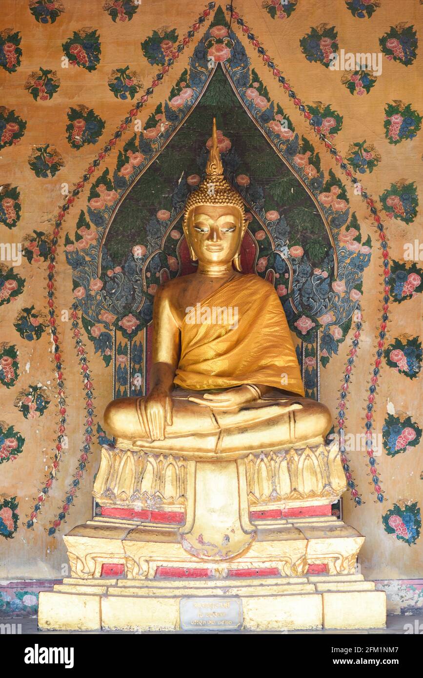 Golden buddha statue at a temple in Thailand. Stock Photo