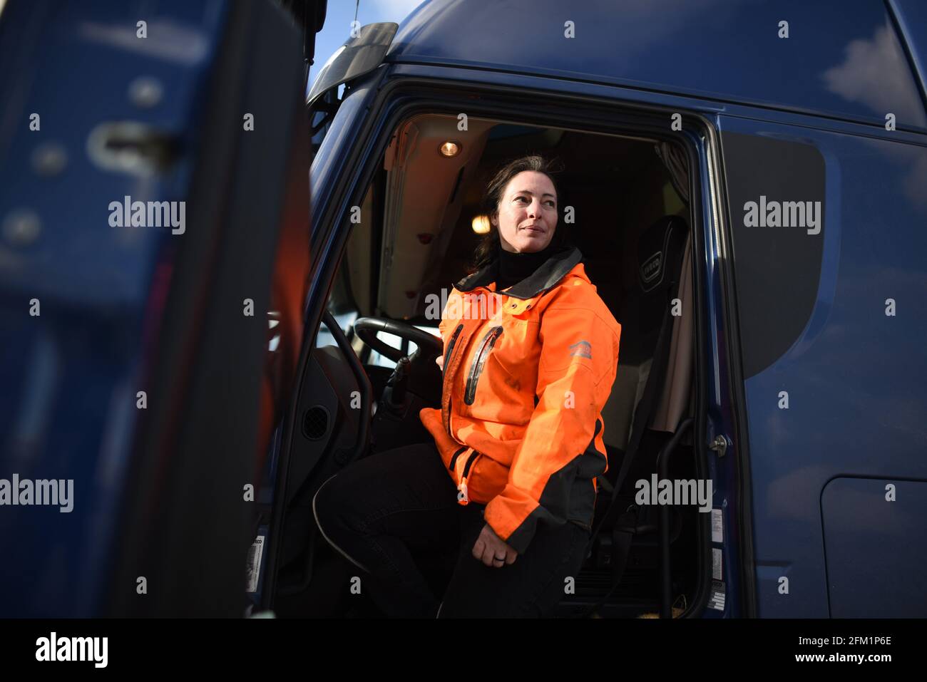 *** STRICTLY NO SALES TO FRENCH MEDIA OR PUBLISHERS - RIGHTS RESERVED ***February 18, 2021 - Cherbourg, France: Portrait of a French woman trucker, who said logistics at Cherbourg harbour had become chaotic following Brexit. Officials at the Normandy port of Cherbourg reported that their business tripled since Brexit led to a surge in direct traffic between the European Union and the island of Ireland. Freight ferries take 17 hours to cross the sea between France and Ireland. Stock Photo