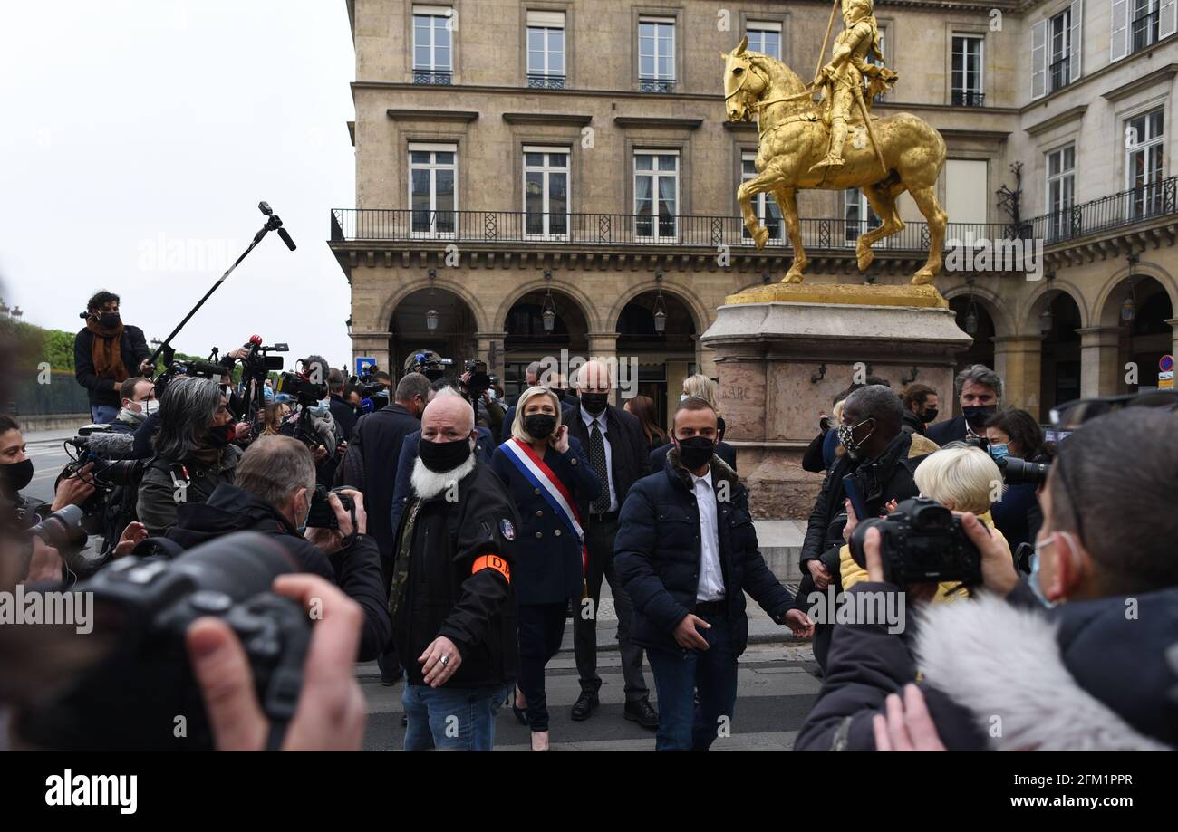 *** STRICTLY NO SALES TO FRENCH MEDIA OR PUBLISHERS - RIGHTS RESERVED ***May 01, 2021 - Paris, France: Marine Le Pen, leader of the far-right Rassemblement National party (RN) talks to journalists after laying a wreath of flowers in front of a statue of Joan of Arc. The traditional May Day ceremony took place as Le Pen prepares to launch her campaign for the regional election. Stock Photo