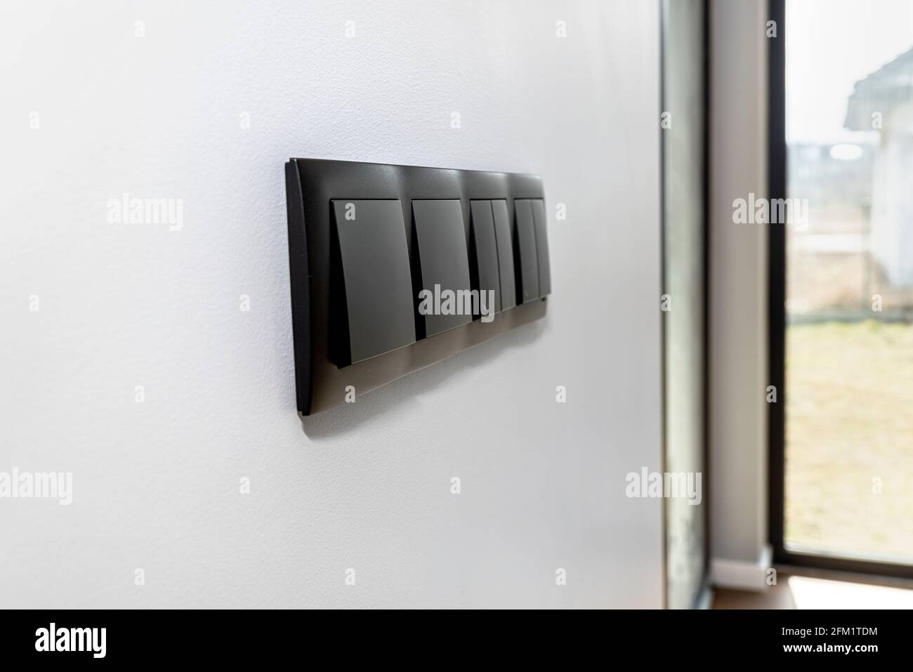 Black frame with a button to switch the lights and roller shutter up ...